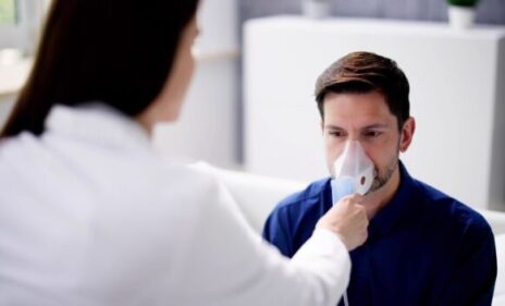 man with copd receiving live in care support with an oxygen mask